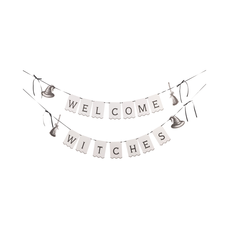 WELCOME WITCHES paper banner set laid flat, both scalloped banners with black satin bows shown full-length.