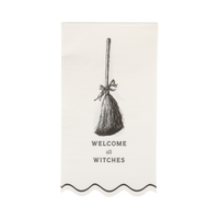 Close-up of the decorative paper napkin with broom design and text design on a clear packaging.