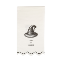 Full view of the paper napkin with a witch hat design and YOU are MAGIC text on a clear packaging.