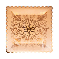 Front of package showing rust-orange plate with copper-foil wheat artwork and scalloped rim.