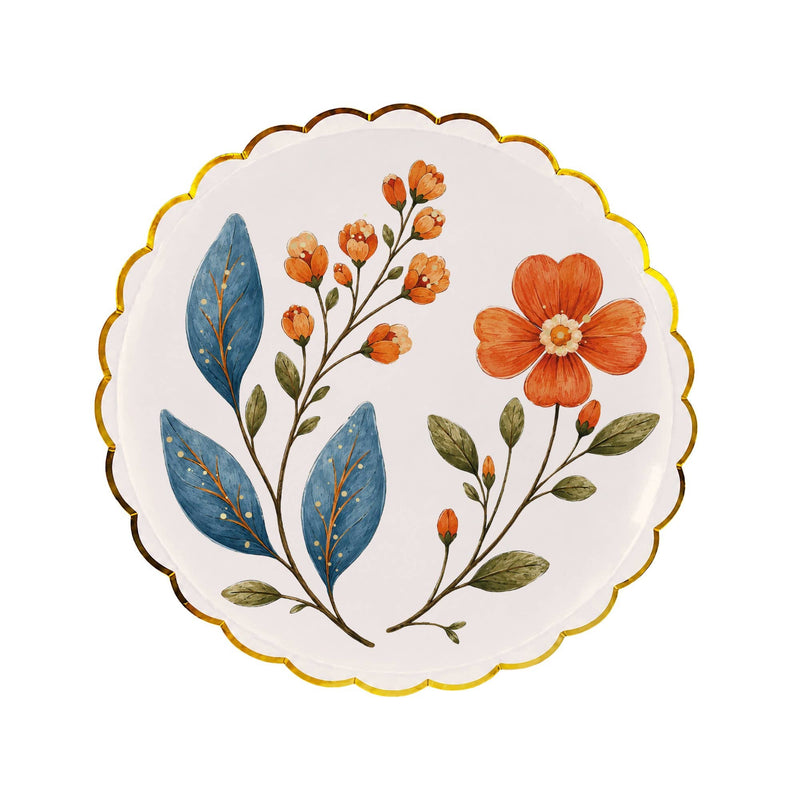 Cream wildflower dessert plate with painted blue leaves, orange blossoms, and a gold scalloped rim on a white background
