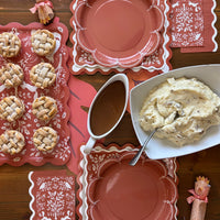 Thanksgiving buffet with mini apple pies on the woodland bamboo tray, rust plates, gravy, mashed potatoes, and turkey crackers