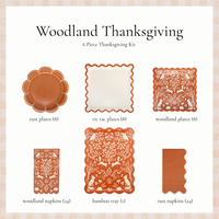 Woodland Thanksgiving party kit with rust plates, ric rac plates, woodland plates, woodland napkins, a bamboo tray, and rust napkins