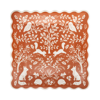 Rust square paper plates with a white woodland print of foxes, owls, squirrels, and hedgehogs, set of 8