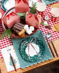 Gingham table with the wreath plate, s'mores, and a plaid runner.