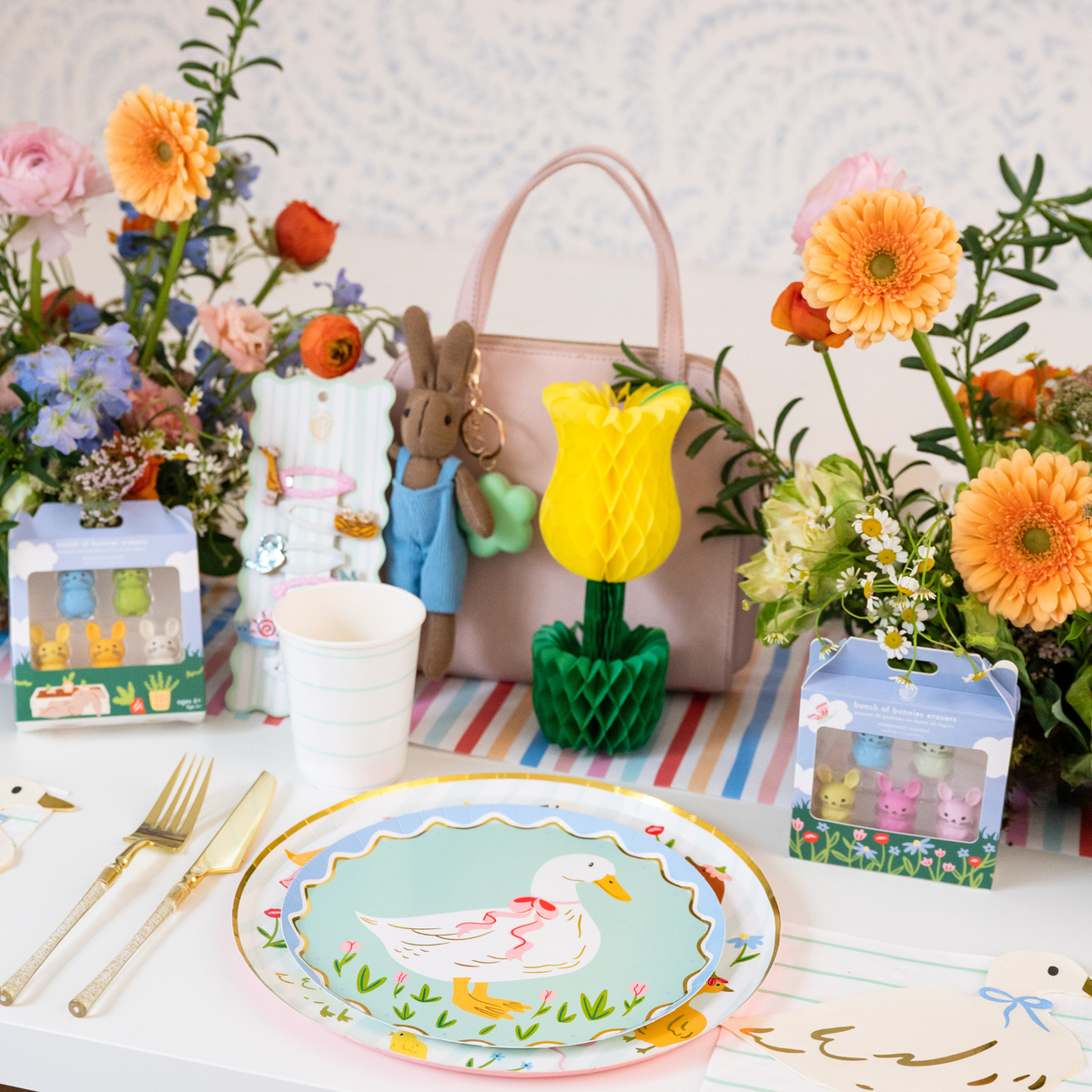 Yellow honeycomb tulip centerpiece displayed among spring florals and Easter décor